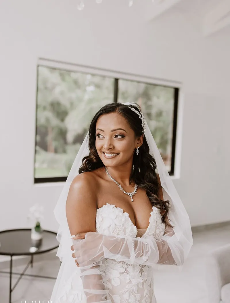 A Lustique artist styling a bride